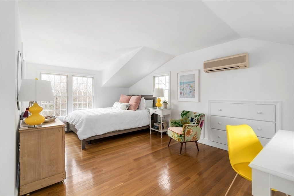 8 Rockwood Road Hingham, MA 02043 - Photo 19 of 27 a bedroom with a bed and wooden floor