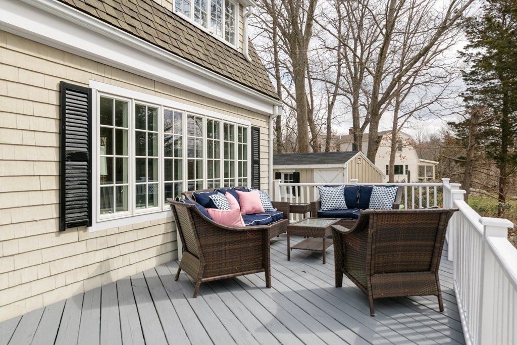 8 Rockwood Road Hingham, MA 02043 - Photo 22 of 27 a view of a deck with table and chairs and wooden floor