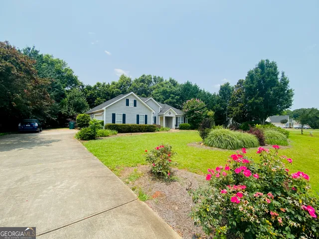 a front view of a house with a yard