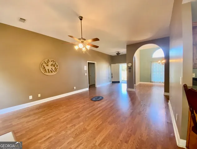 a view of livingroom and kitchen with wooden floor
