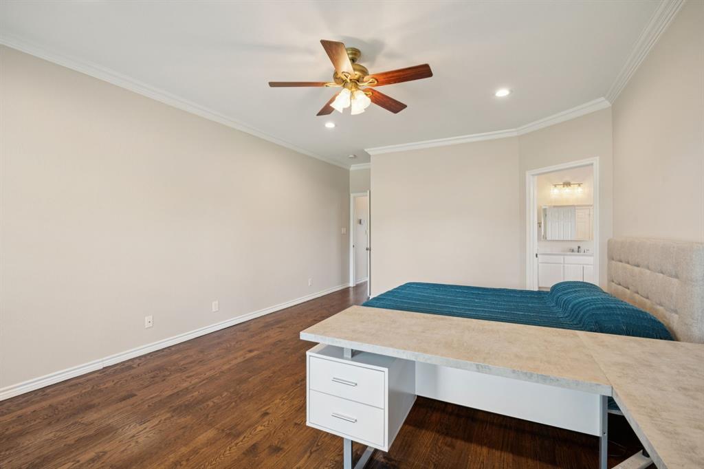 9530 County Road 581 Anna, TX 75409 - Photo 17 of 39 a bedroom with a bed and a ceiling fan
