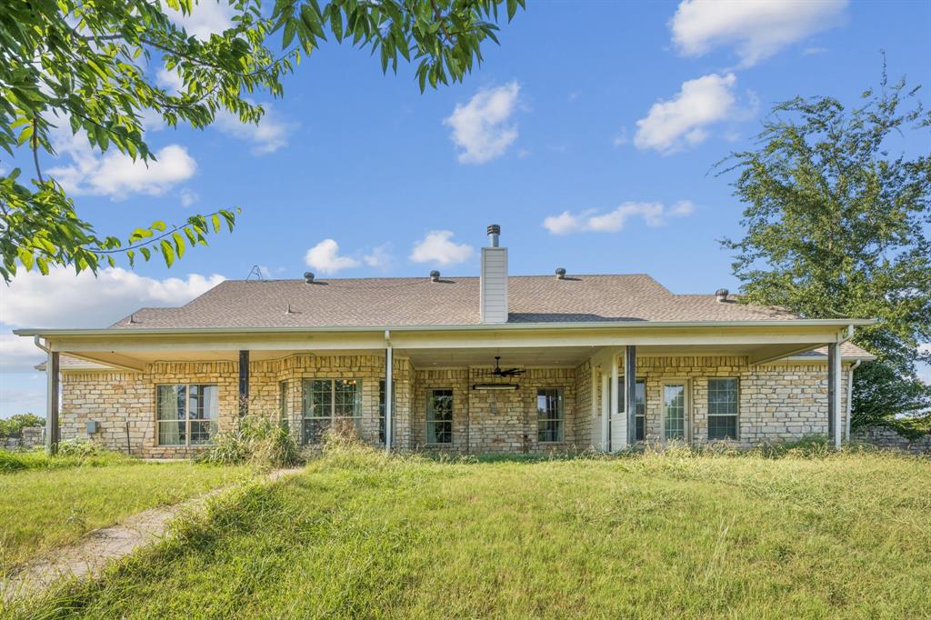 9530 County Road 581 Anna, TX 75409 - Photo 30 of 39 a front view of a house with a yard