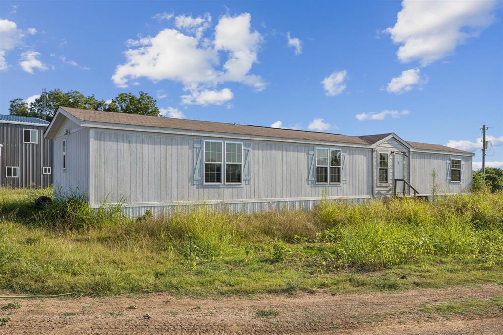 9530 County Road 581 Anna, TX 75409 - Photo 35 of 39 a view of a house with backyard