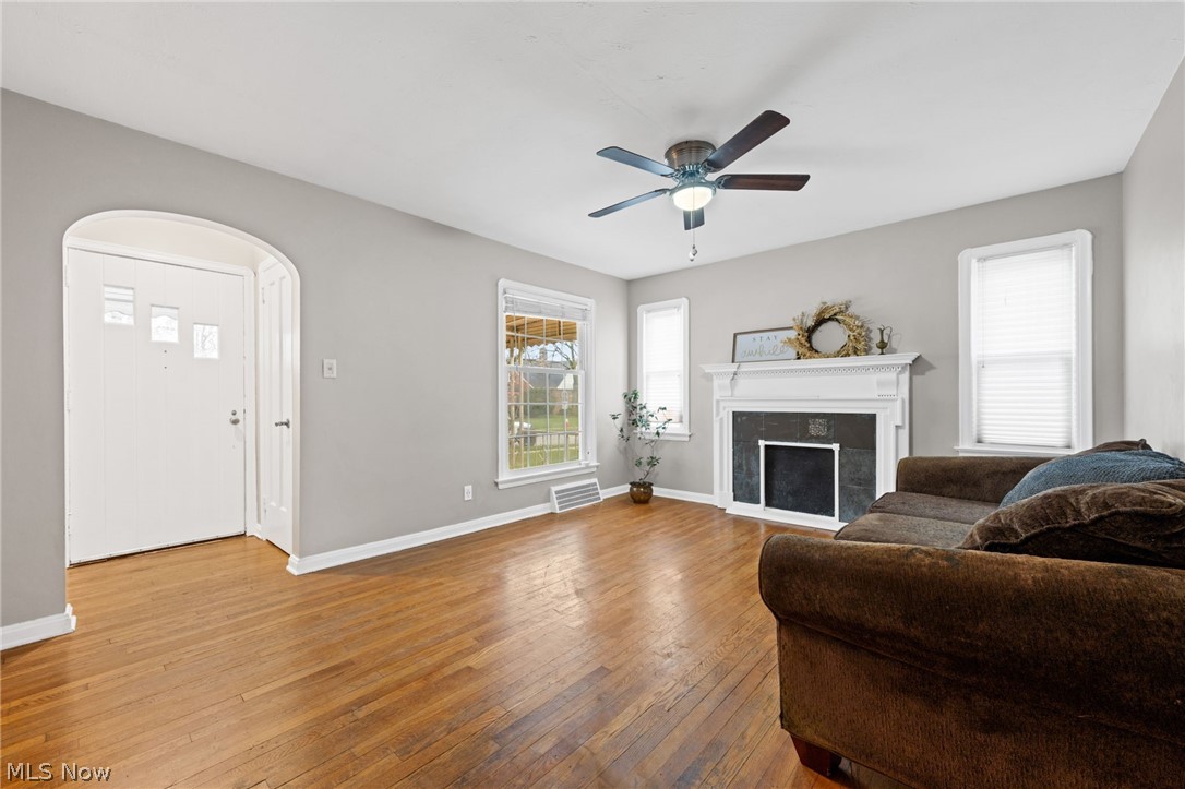 2513 Ralph Avenue Cleveland, OH 44109 - Photo 3 of 14 Living room with a high end fireplace, light hardwood / wood-style floors, and ceiling fan