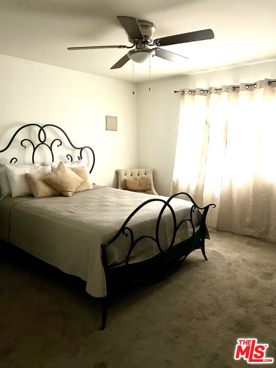 37200 Glen Oaks Road, Unit 3 Temecula, CA 92592 - Photo 23 of 42 a bedroom with a bed and a mirror