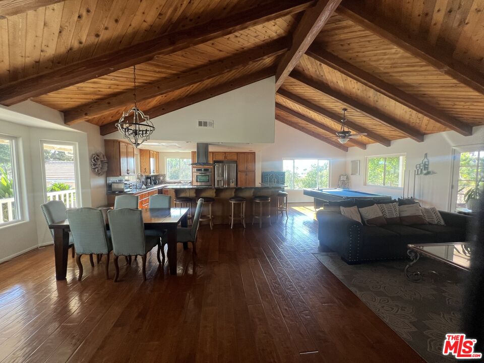 37200 Glen Oaks Road, Unit 3 Temecula, CA 92592 - Photo 25 of 42 a view of a dining room with furniture window and wooden floor