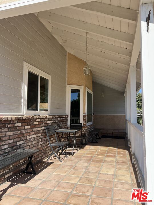 37200 Glen Oaks Road, Unit 3 Temecula, CA 92592 - Photo 30 of 42 a building outdoor space with patio furniture and potted plants