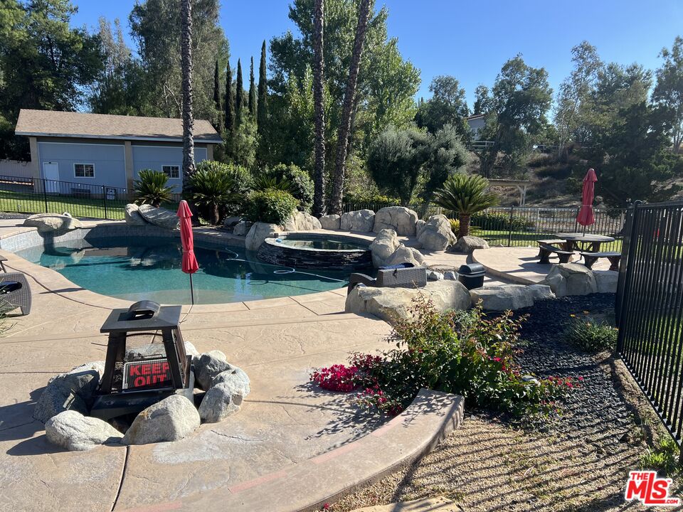 37200 Glen Oaks Road, Unit 3 Temecula, CA 92592 - Photo 35 of 42 a view of backyard with outdoor seating and trees in the background