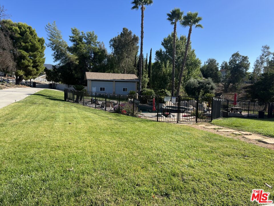 37200 Glen Oaks Road, Unit 3 Temecula, CA 92592 - Photo 38 of 42 a swimming pool with outdoor seating and yard