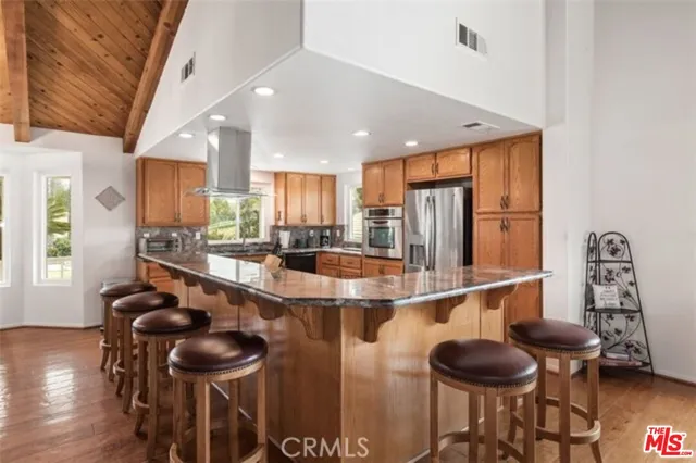 a view of a porch with wooden floor