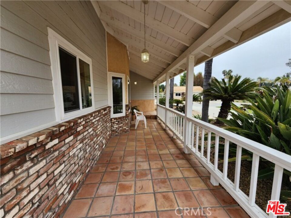 37200 Glen Oaks Road, Unit 3 Temecula, CA 92592 - Photo 8 of 42 a view of a porch with wooden floor