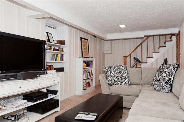 11 Stafford Road Newton, MA 02459 - Photo 18 of 21 a living room with furniture and a flat screen tv
