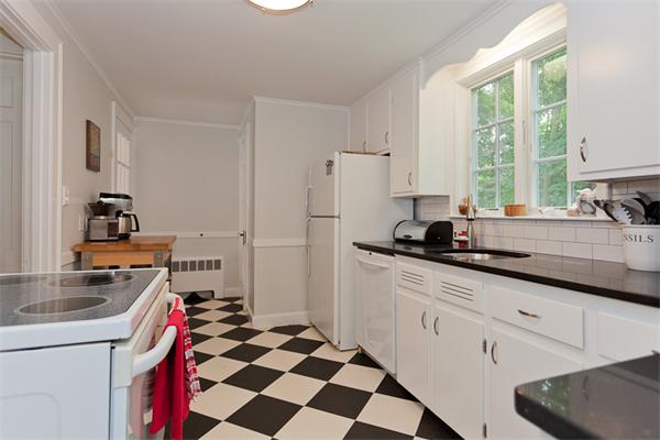 11 Stafford Road Newton, MA 02459 - Photo 9 of 21 a kitchen with a sink a stove a refrigerator and cabinets