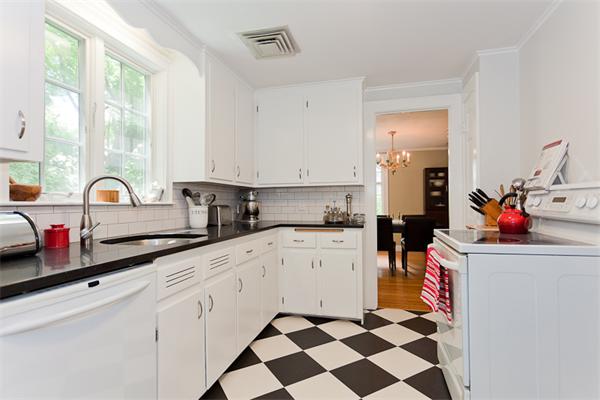 11 Stafford Road Newton, MA 02459 - Photo 10 of 21 a kitchen with a sink a stove and cabinets