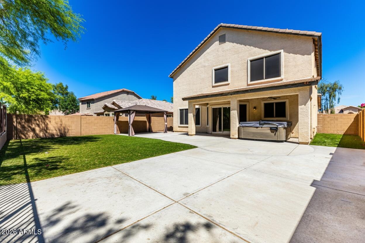 4208 South Sawmill Road Gilbert, AZ 85297 - Photo 44 of 46 a front view of a house with a yard and garage