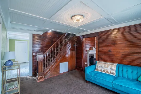 a view of livingroom with furniture and stairs