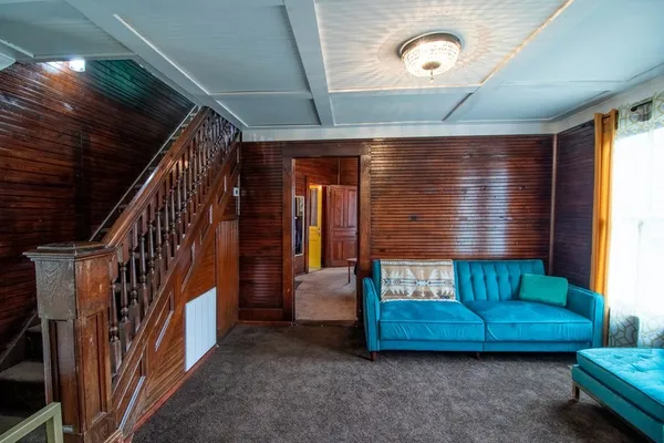 a living room with furniture and a window