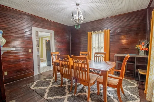 a view of a dining room with furniture and window