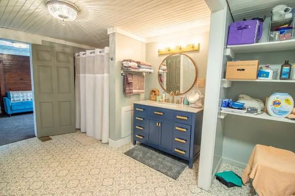 a bedroom with a dresser and a dresser