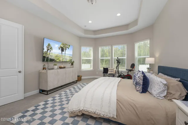 a spacious bathroom with a granite countertop sink mirror and shower