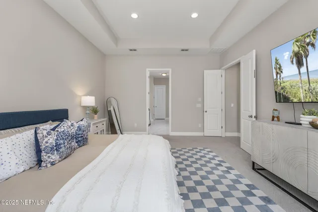 a bathroom with a tub shower and a mirror