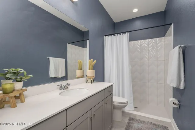 a living room with furniture and large window