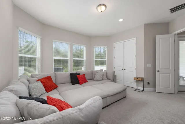 a bathroom with a granite countertop sink toilet and a mirror
