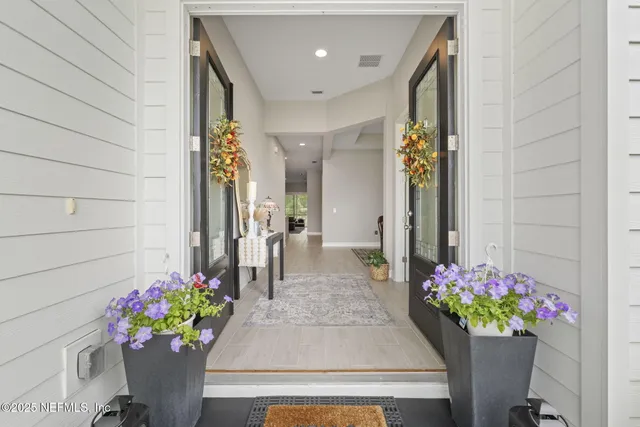 a front view of a house having an entryway