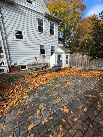 a backyard of a house with seating space