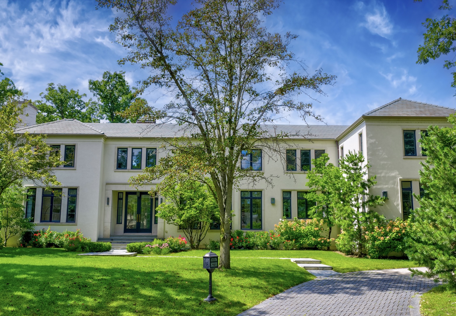 a front view of a house with a yard