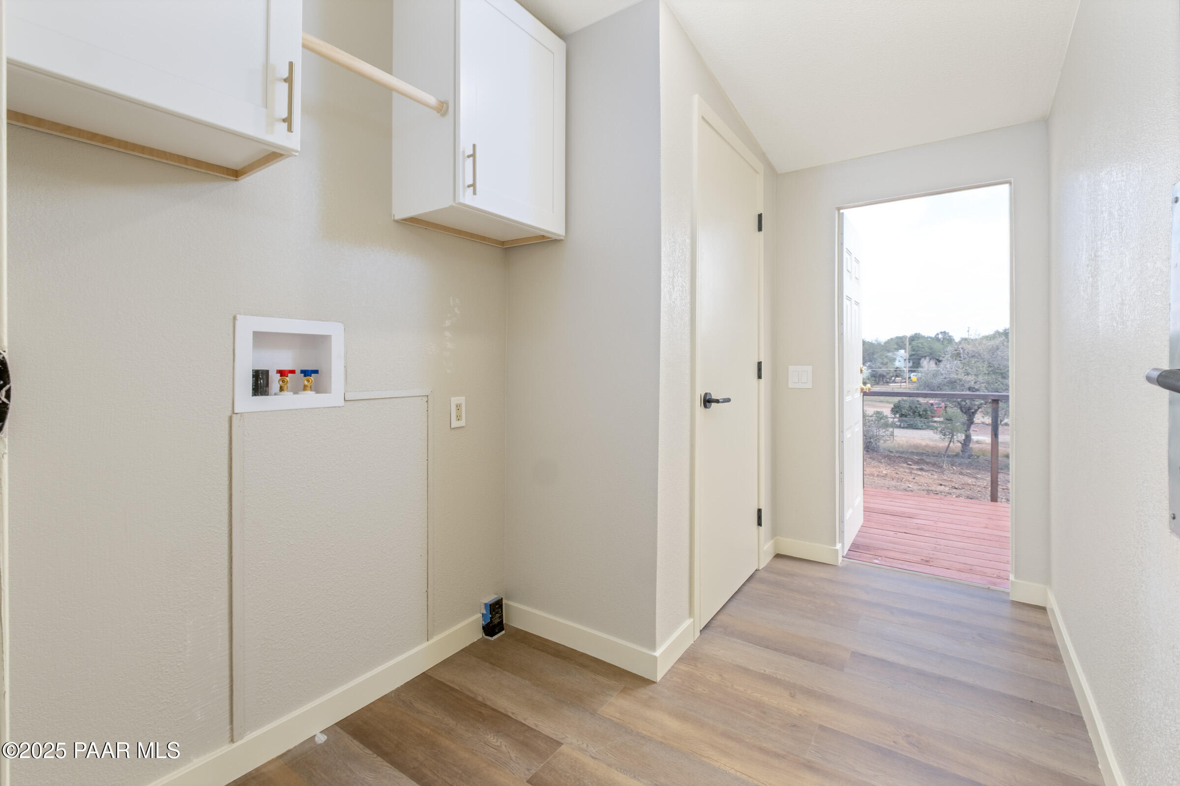 6635 North Double Tree Road Prescott, AZ 86305 - Photo 49 of 69 a view of a hallway with wooden floor and a bathroom