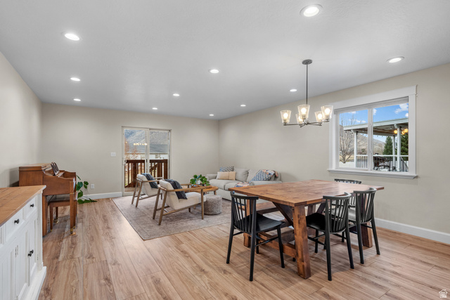 1896 West 800 North Mapleton, UT 84663 - Photo 6 of 55 Dining area featuring light wood-style flooring, healthy amount of natural light, and a chandelier