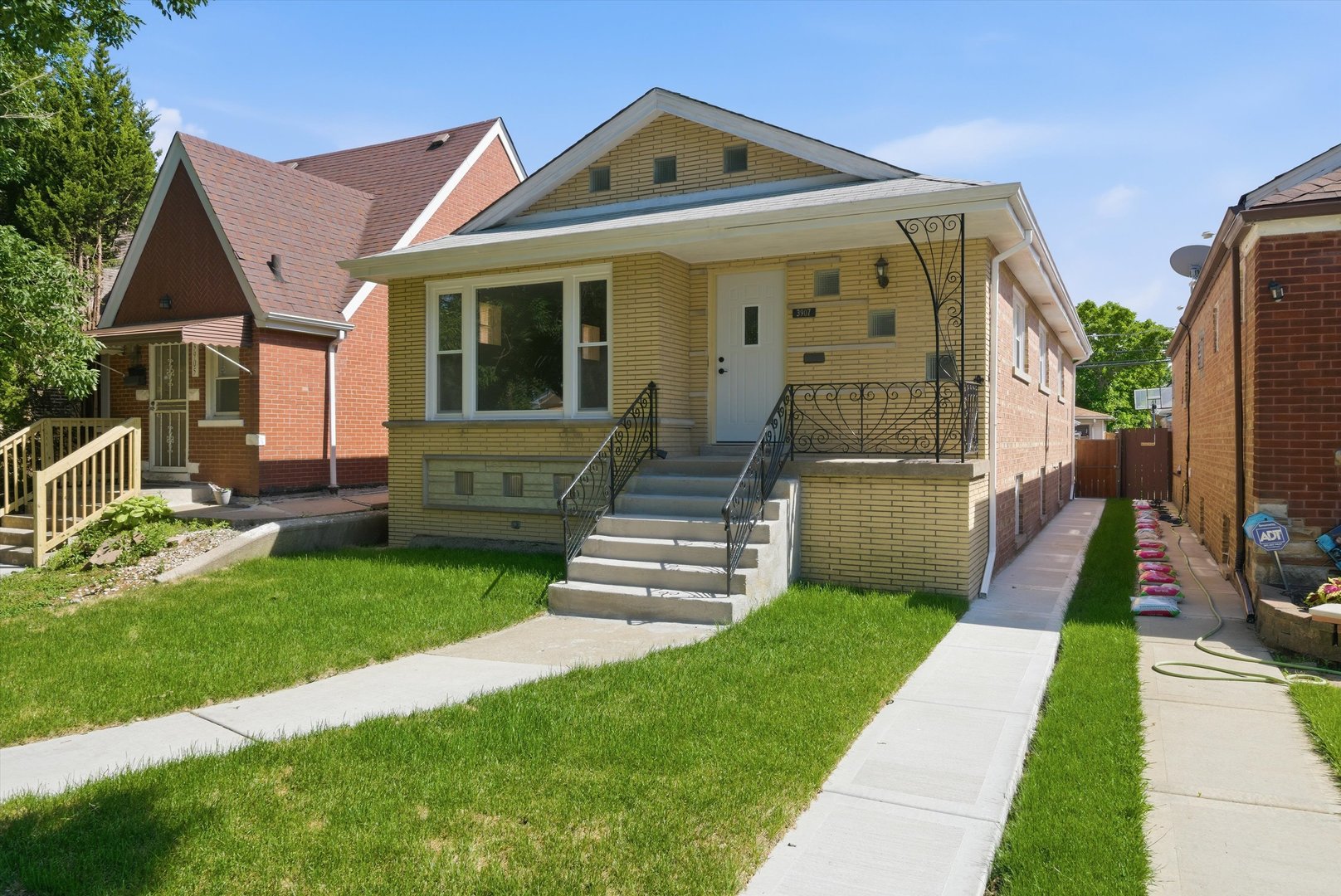 3907 West Marquette Road Chicago, IL 60629 - Photo 1 of 32 a front view of a house with a yard