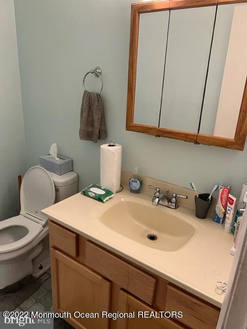 282 Privateer Road Manahawkin, NJ 08050 - Photo 13 of 18 a bathroom with a sink and a toilet