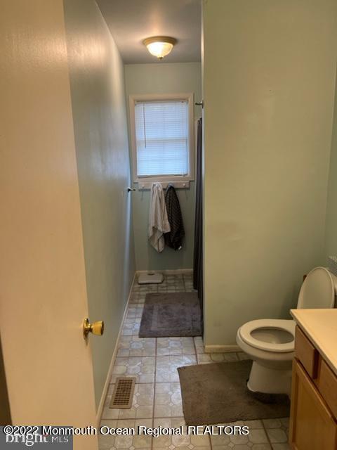 282 Privateer Road Manahawkin, NJ 08050 - Photo 14 of 18 a bathroom with a toilet and a shower