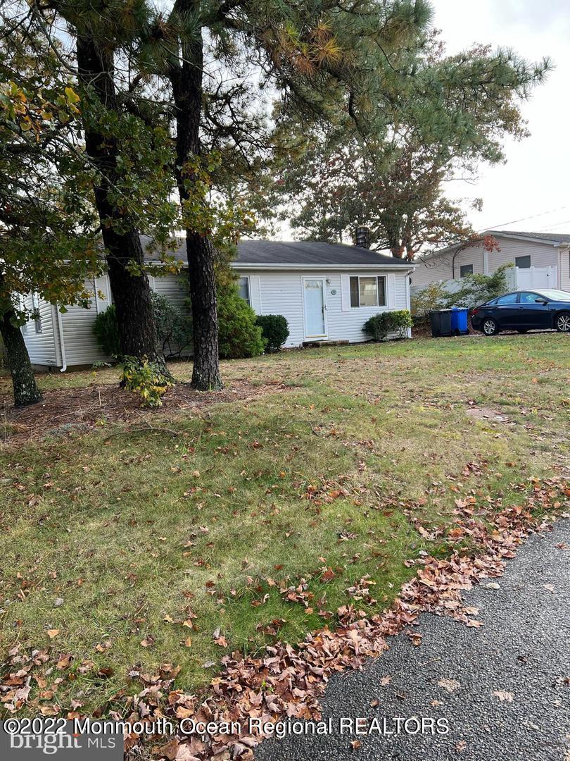 282 Privateer Road Manahawkin, NJ 08050 - Photo 18 of 18 a front view of a house with a yard