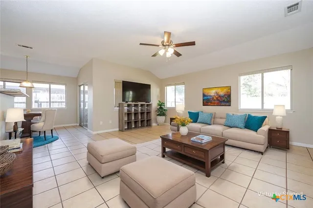 a living room with furniture and a window