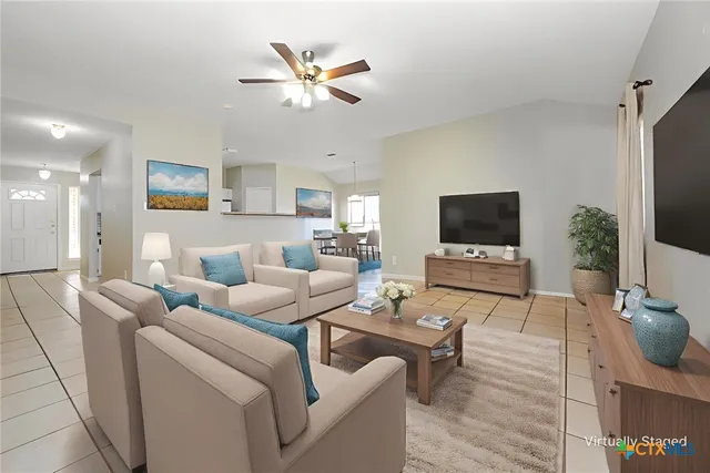 a living room with furniture and a flat screen tv