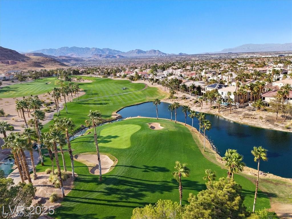 87 Tall Ruff Drive Las Vegas, NV 89148 - Photo 2 of 71 Green fairways and tranquil water features create an idyllic desert golf course community.
