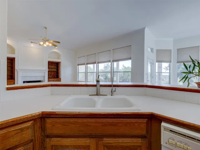 a kitchen with a sink and a window