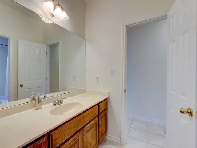 a bathroom with a sink a vanity and a mirror