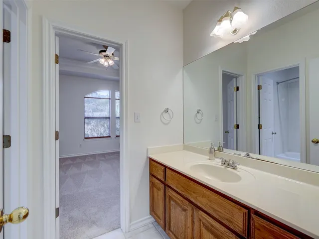 a bathroom with a sink double vanity and a mirror