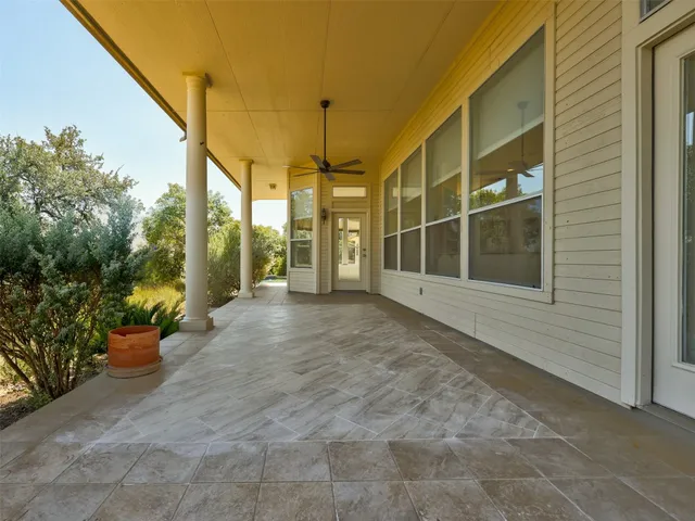 a view of an entryway with flower plants