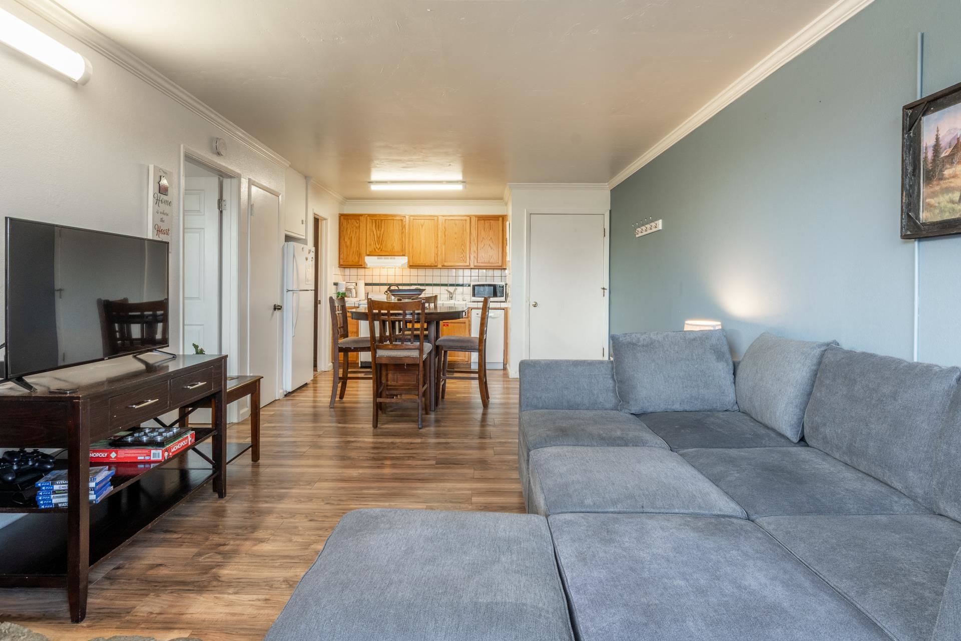 137 Laurel Mountain Road, Unit 312 Mammoth Lakes, CA 93546 - Photo 2 of 37 a living room with furniture and a flat screen tv