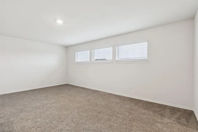 an empty room with a windows