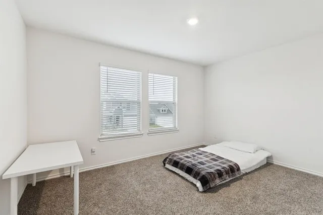 a room with a bed and a window