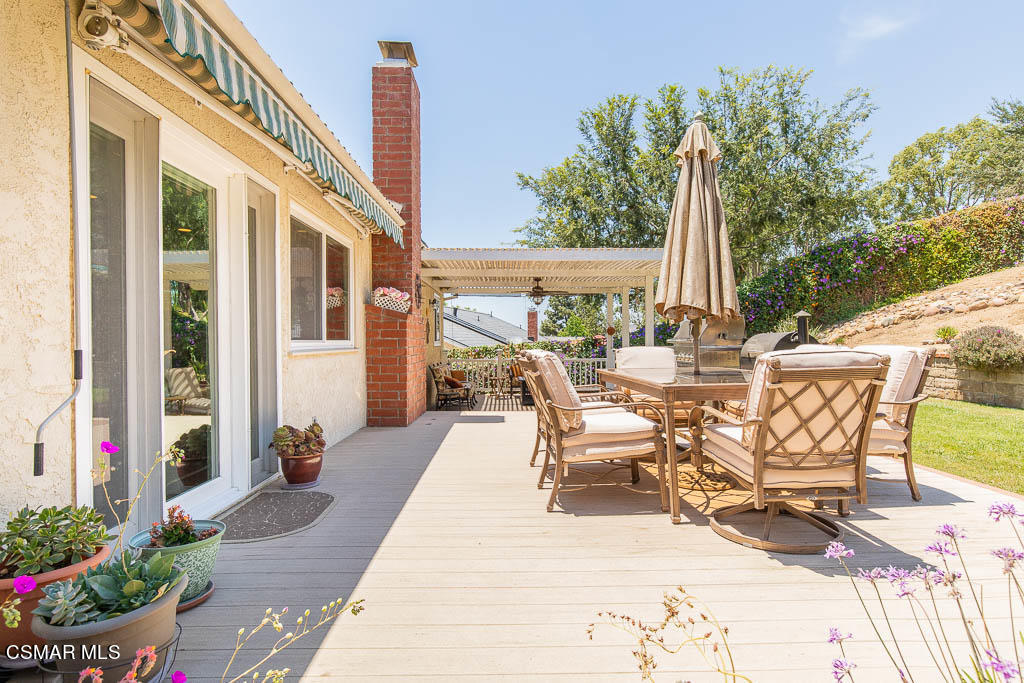 1161 Rambling Road Simi Valley, CA 93065 - Photo 22 of 48 a view of a patio with chairs and tables back yard of the house