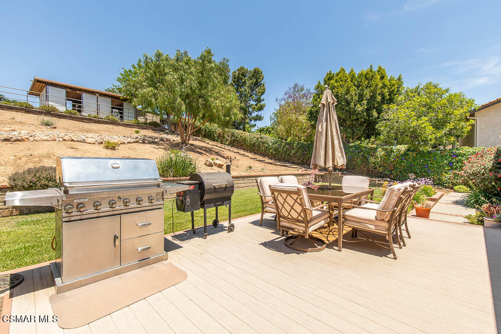 1161 Rambling Road Simi Valley, CA 93065 - Photo 23 of 48 a view of a patio with a table and chairs