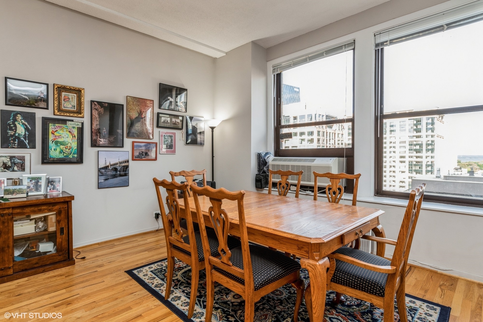 600 South Dearborn Street, Unit 1104 Chicago, IL 60605 - Photo 4 of 10 a dining room with furniture and wooden floor