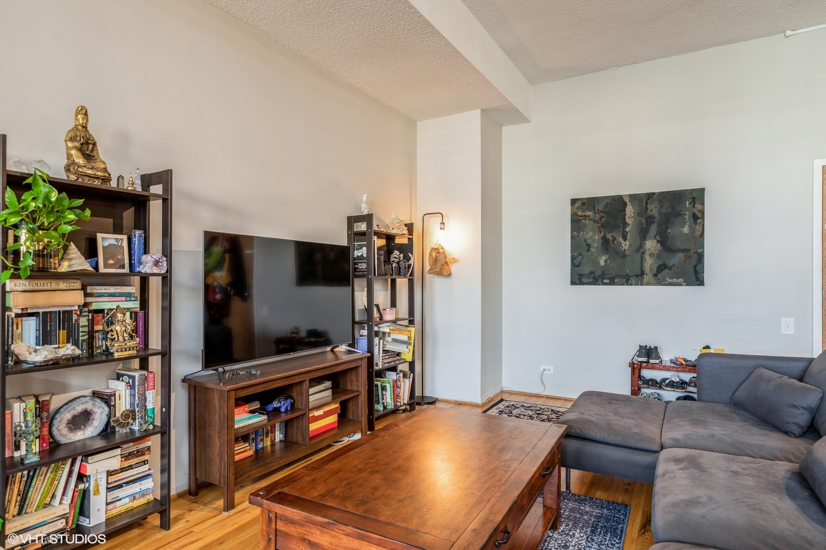 600 South Dearborn Street, Unit 1104 Chicago, IL 60605 - Photo 5 of 10 a living room with furniture and a flat screen tv